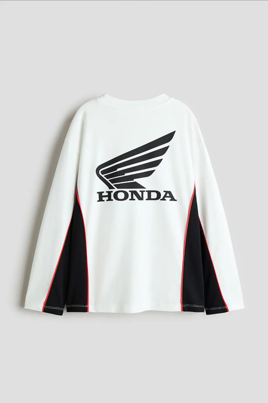 Back of a white long-sleeved top with the black Honda wing logo and black side panels, for H&M