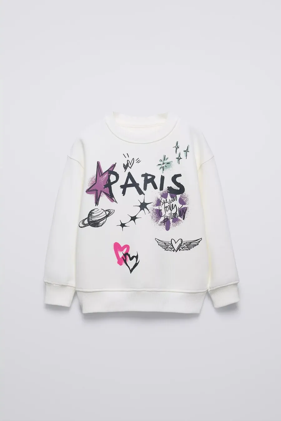 White sweatshirt with a hand-drawn “Paris” print, stars, hearts and a planet, for Zara